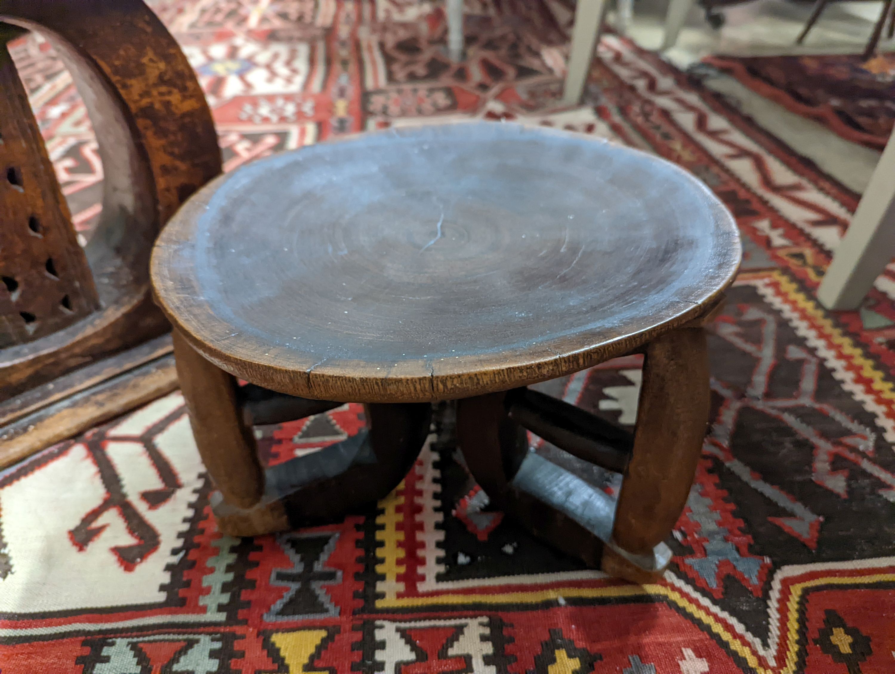 Two African carved hardwood stools, larger length 43cm, depth 19cm, height 37cm